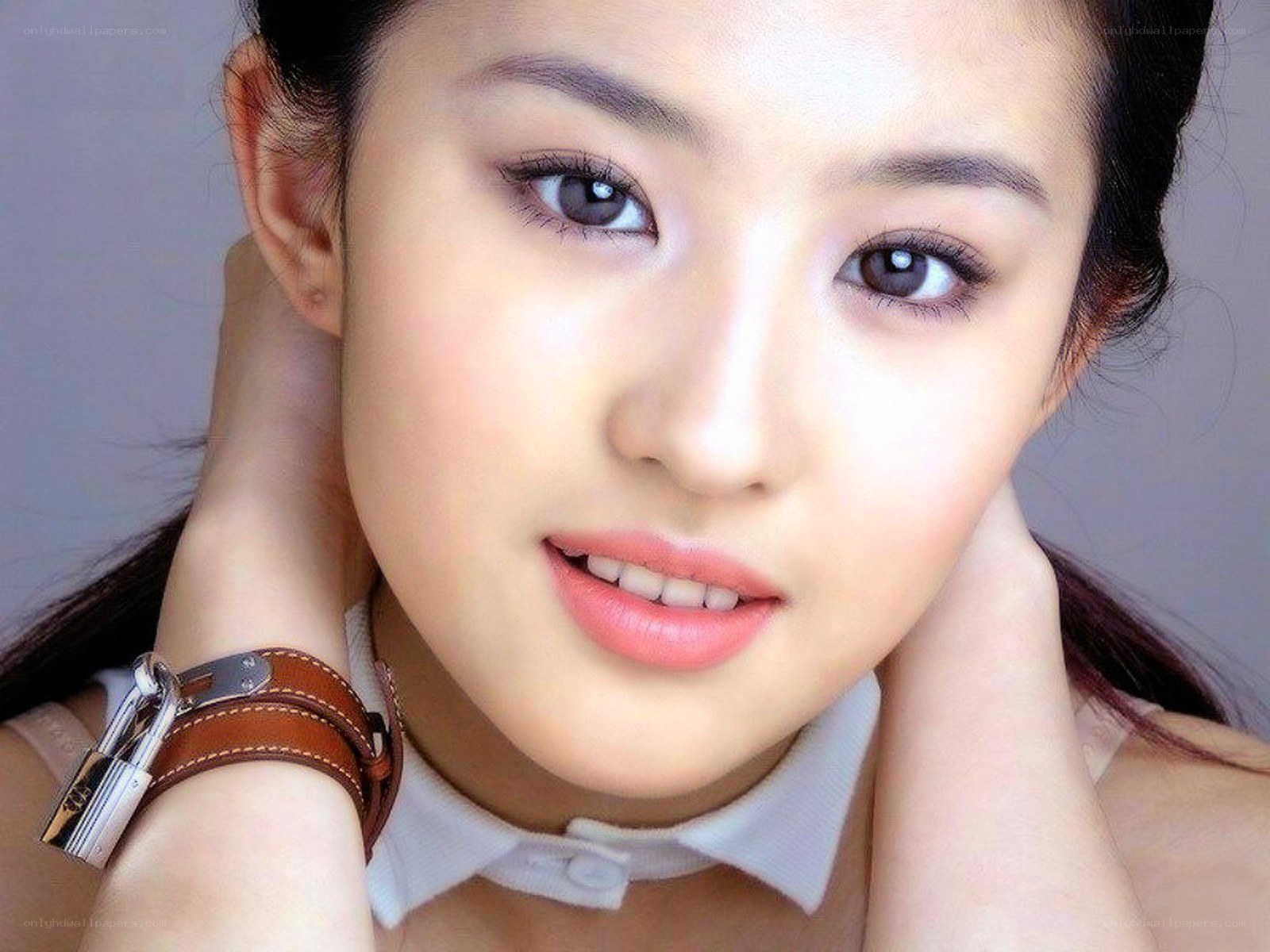 woman with brown watch