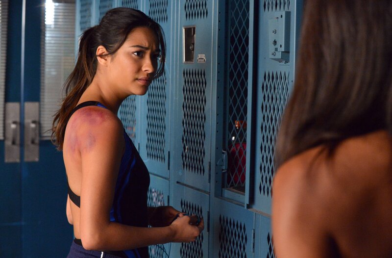 woman with bruise in locker room
