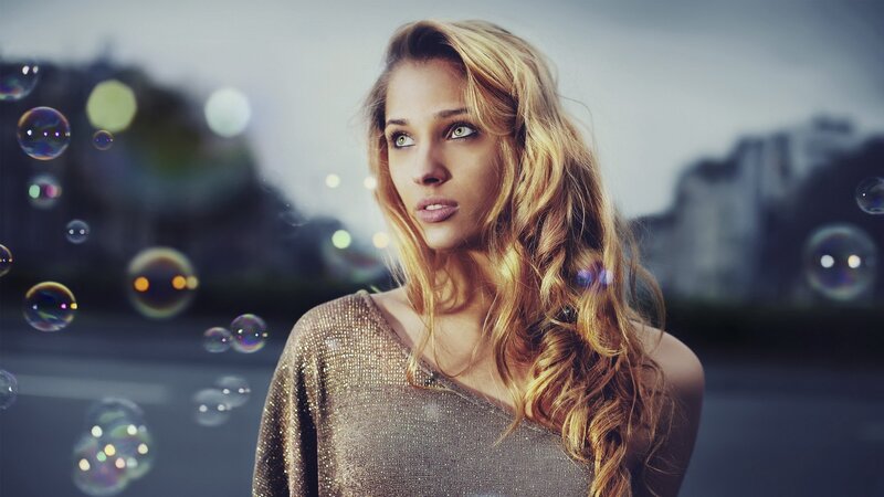 woman with bubbles in city