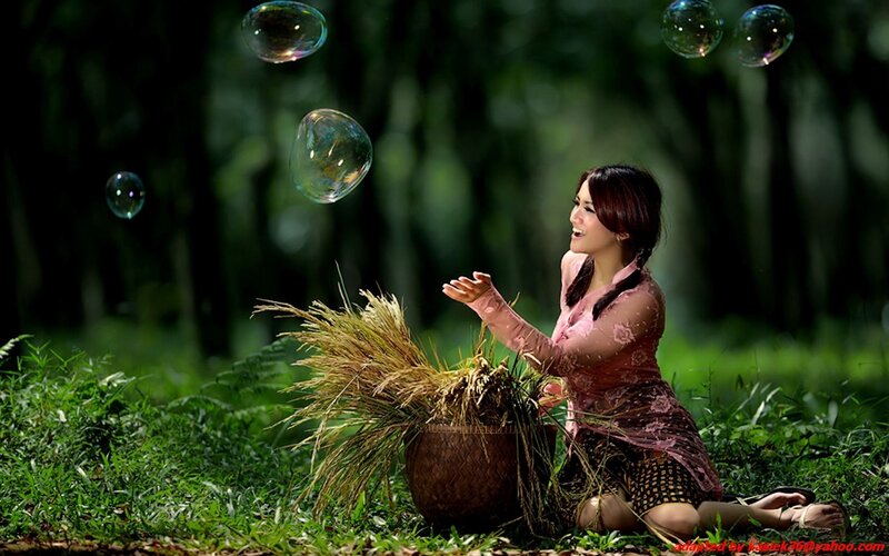 Woman with bubbles in forest