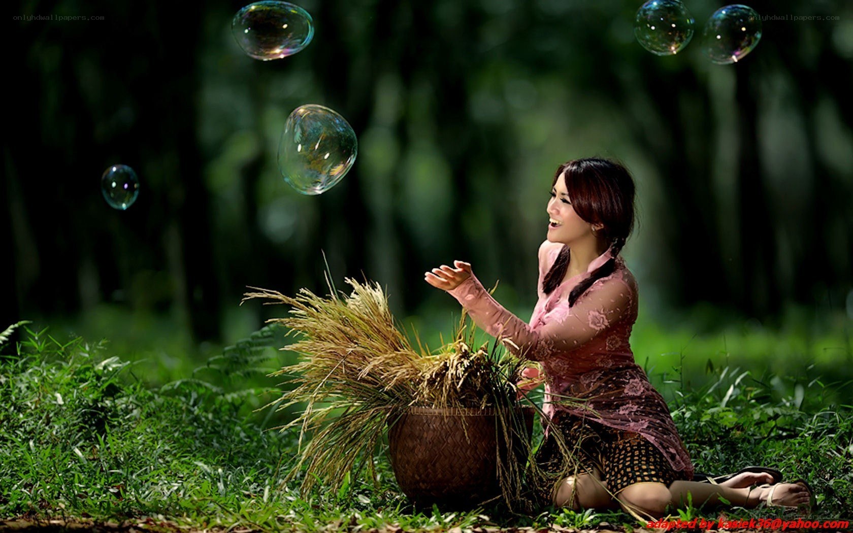 Woman with bubbles in forest
