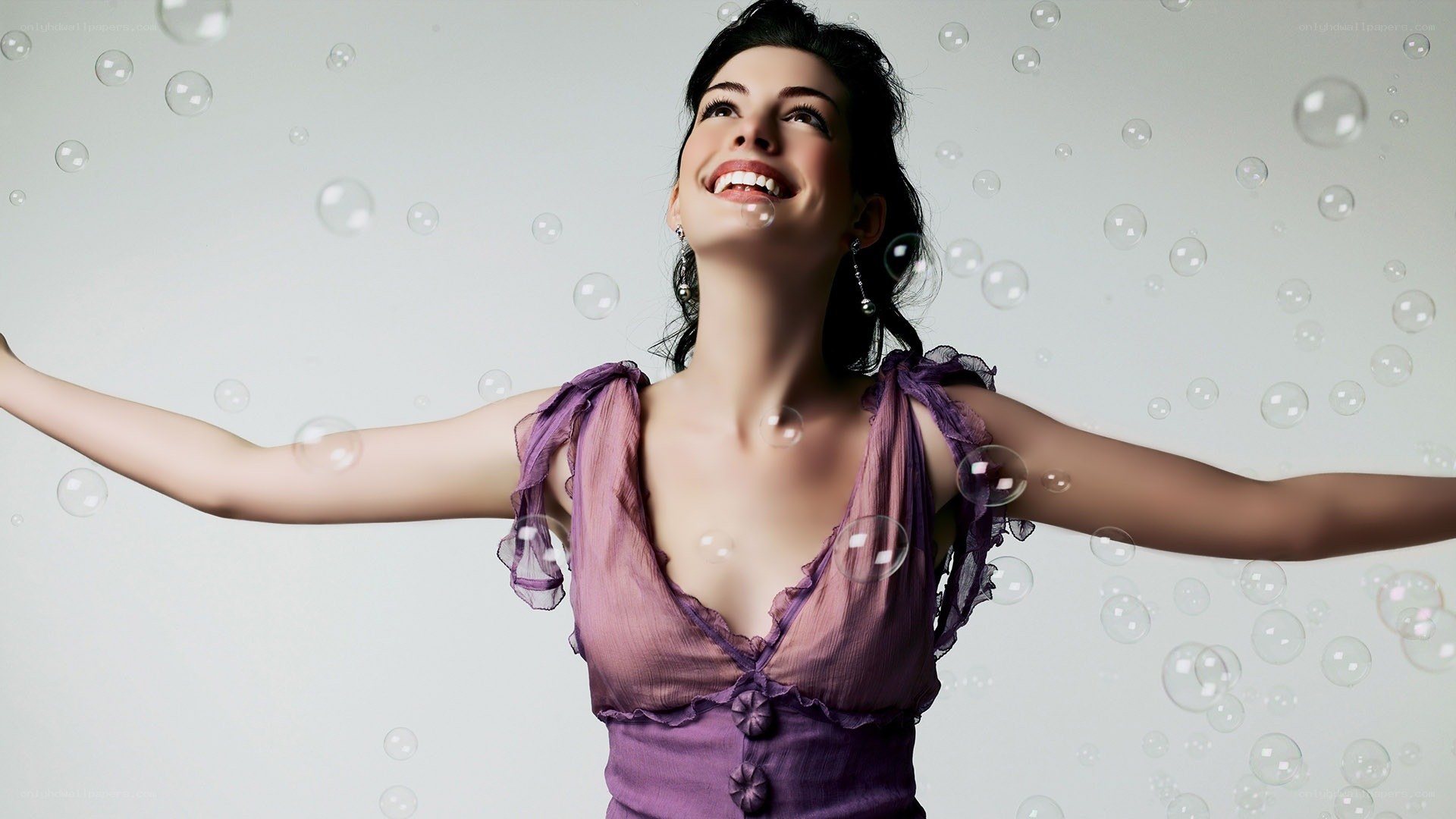 woman with bubbles smiling