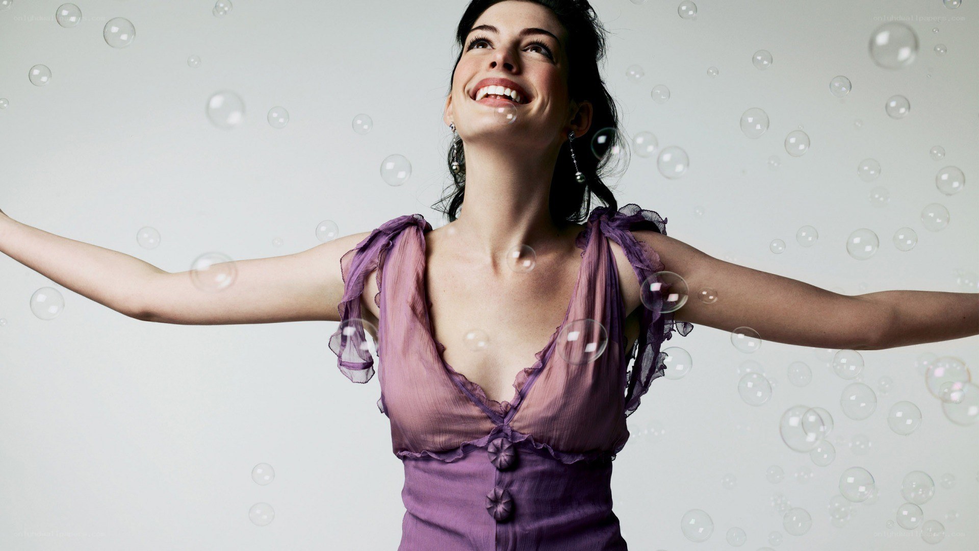 woman with bubbles smiling