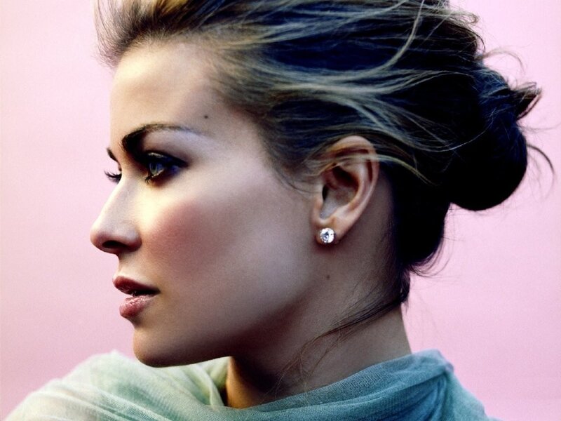 woman with bun and diamond earring