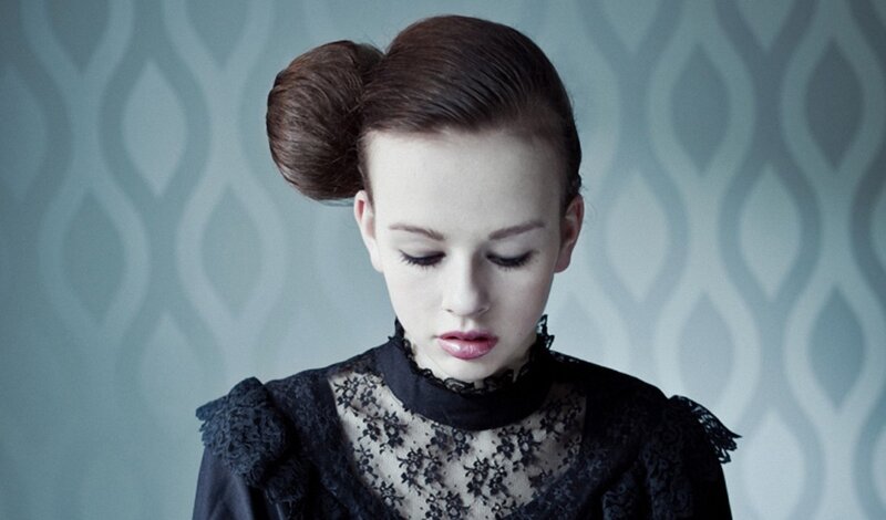 Woman with Bun Hairstyle — Black, Somber
