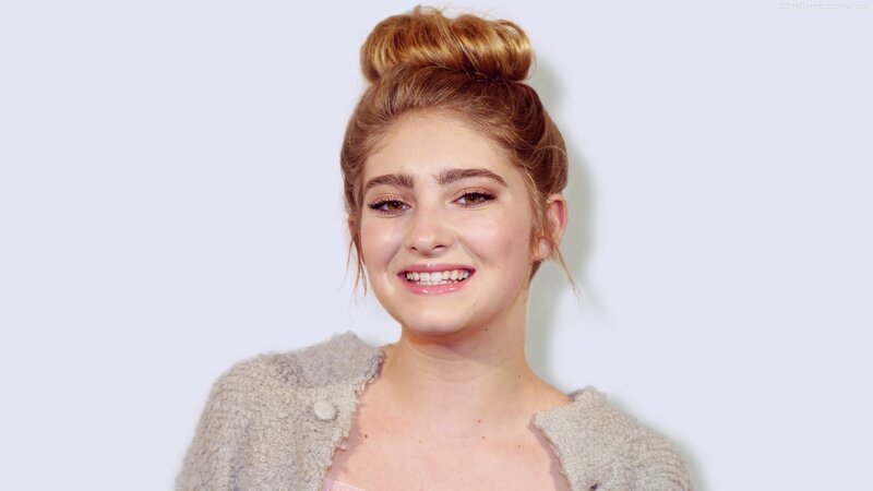 woman with bun hairstyle smiling