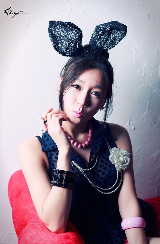 woman with bunny ears and pink accessories