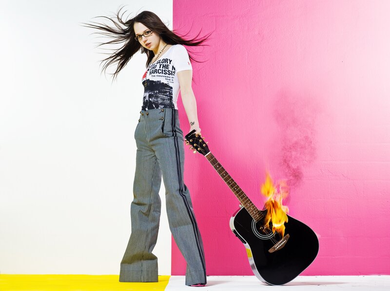 Woman with burning guitar