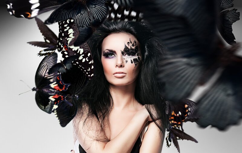 woman with butterflies and makeup