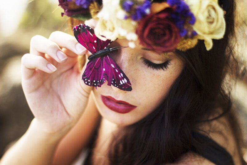 woman with butterfly and flower crown