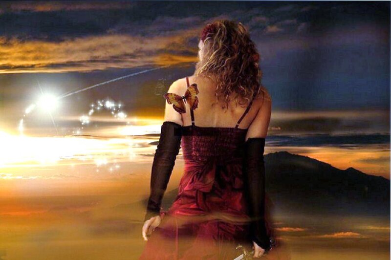 woman with butterfly at sunset