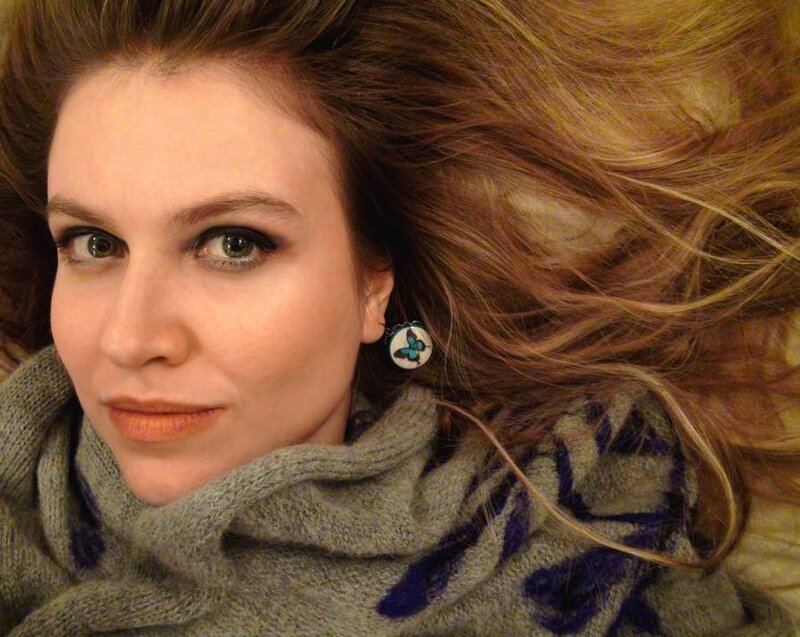 woman with butterfly earring