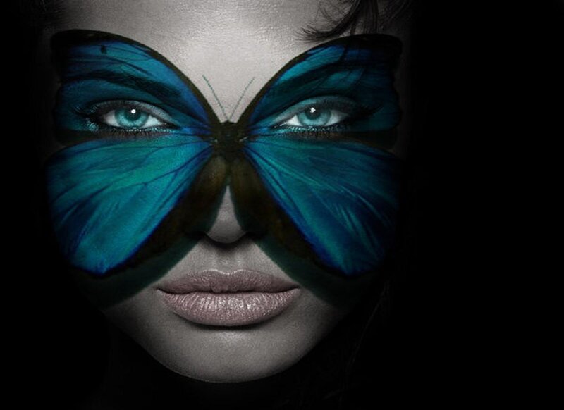 woman with butterfly face art