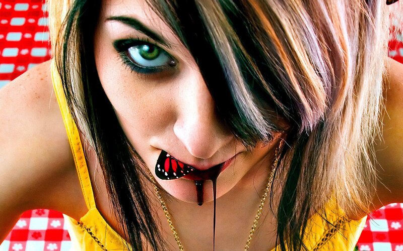 woman with butterfly in mouth