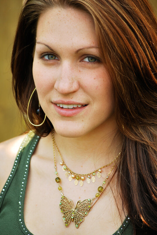 woman with butterfly necklace