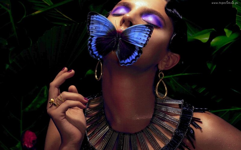 woman with butterfly on face