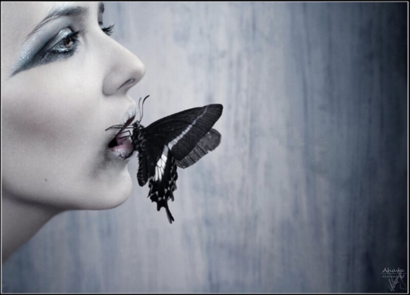 woman with butterfly on lips