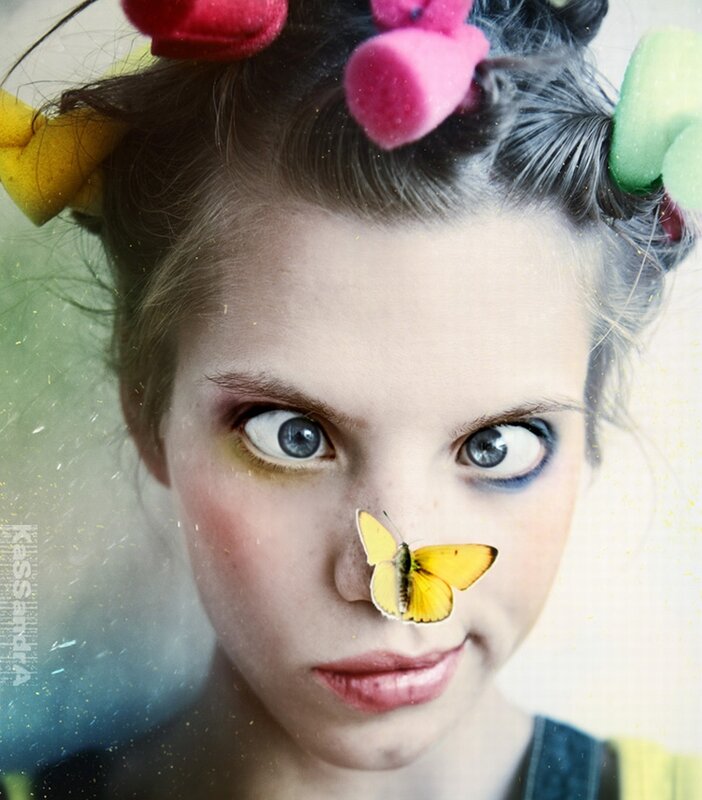 woman with butterfly on nose