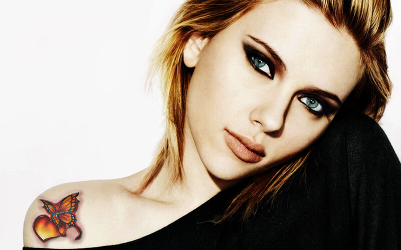 woman with butterfly tattoo