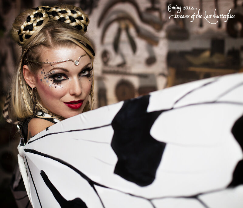 Woman with Butterfly Wings — Black, Dramatic, Photograph, Braid