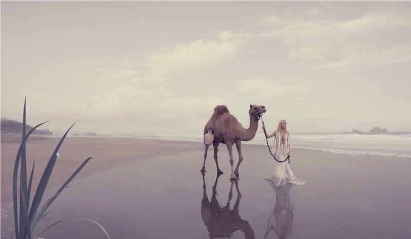 Woman with Camel on Beach