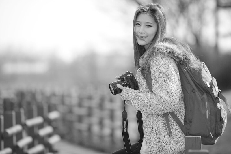 woman with camera and backpack