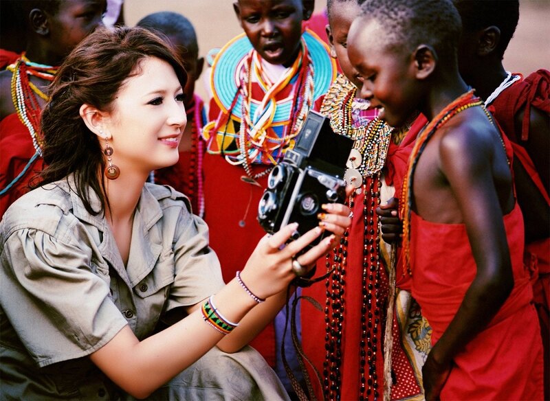 Woman with camera and children