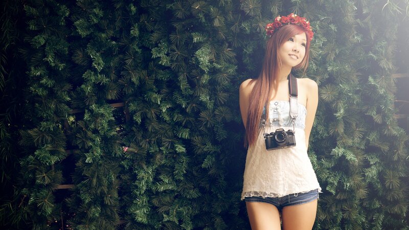 Woman with camera and flower crown
