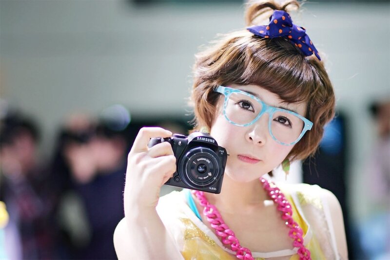 Woman with camera and glasses