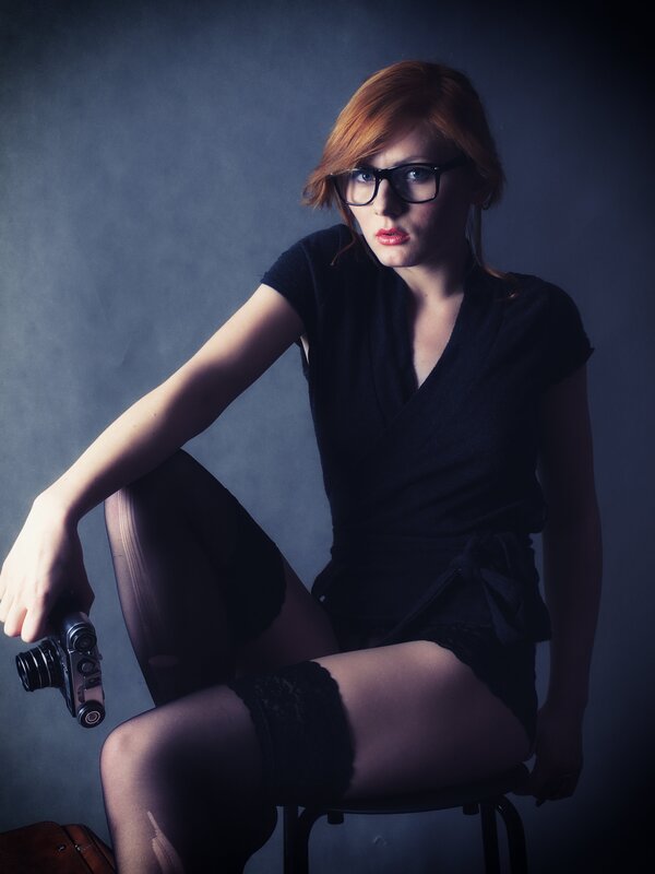Woman with camera and glasses