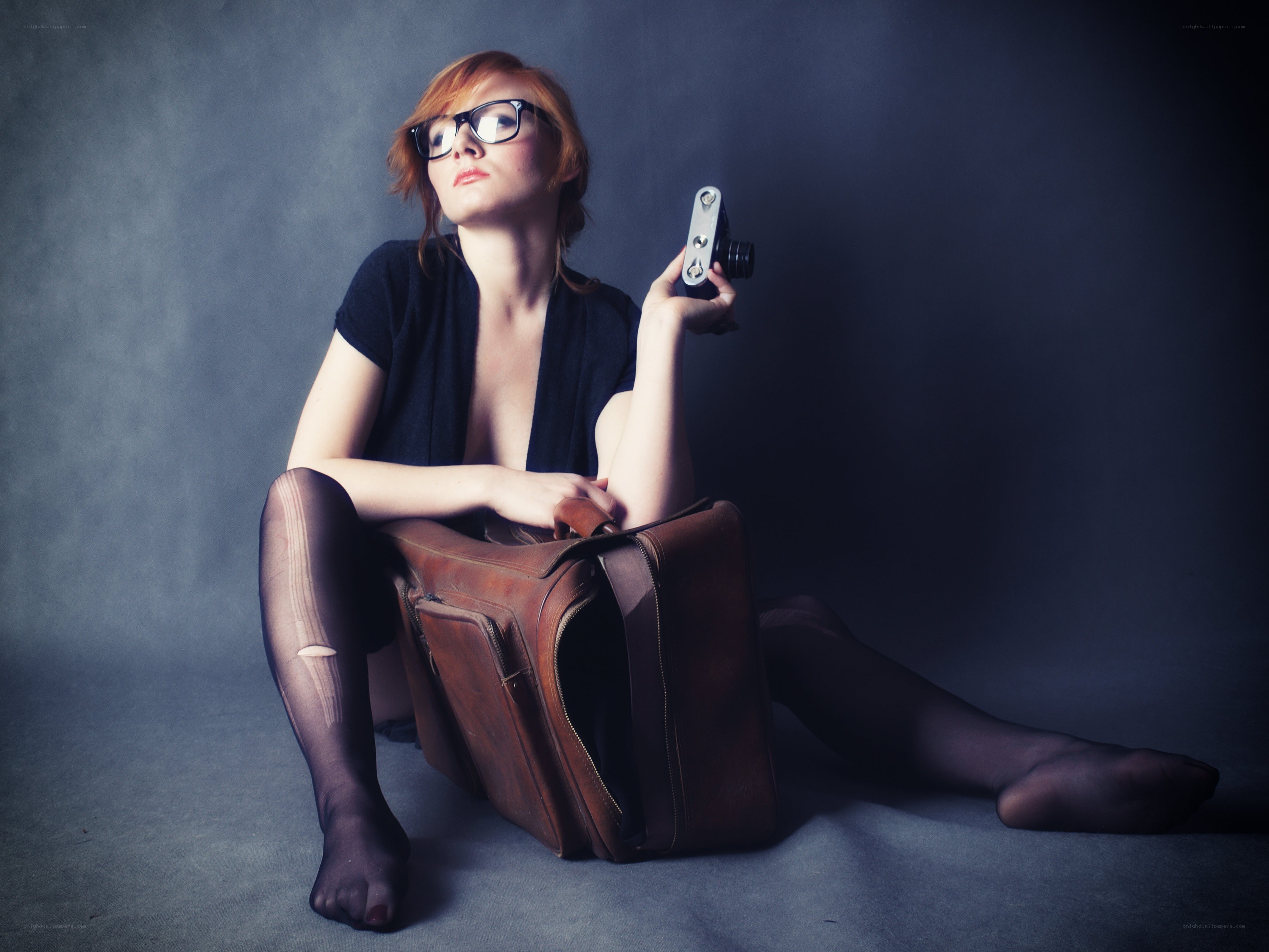 woman with camera and suitcase