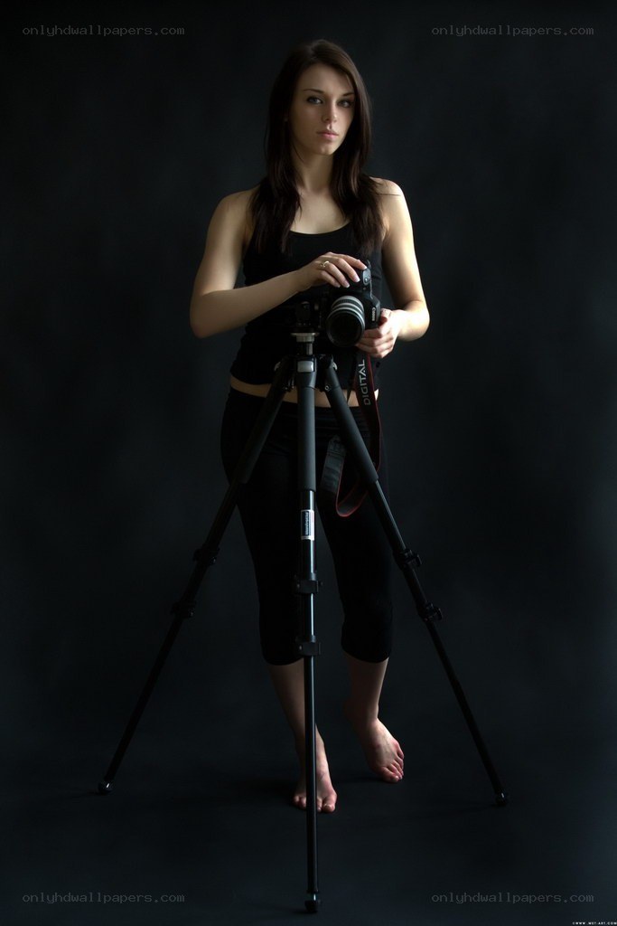 woman with camera and tripod