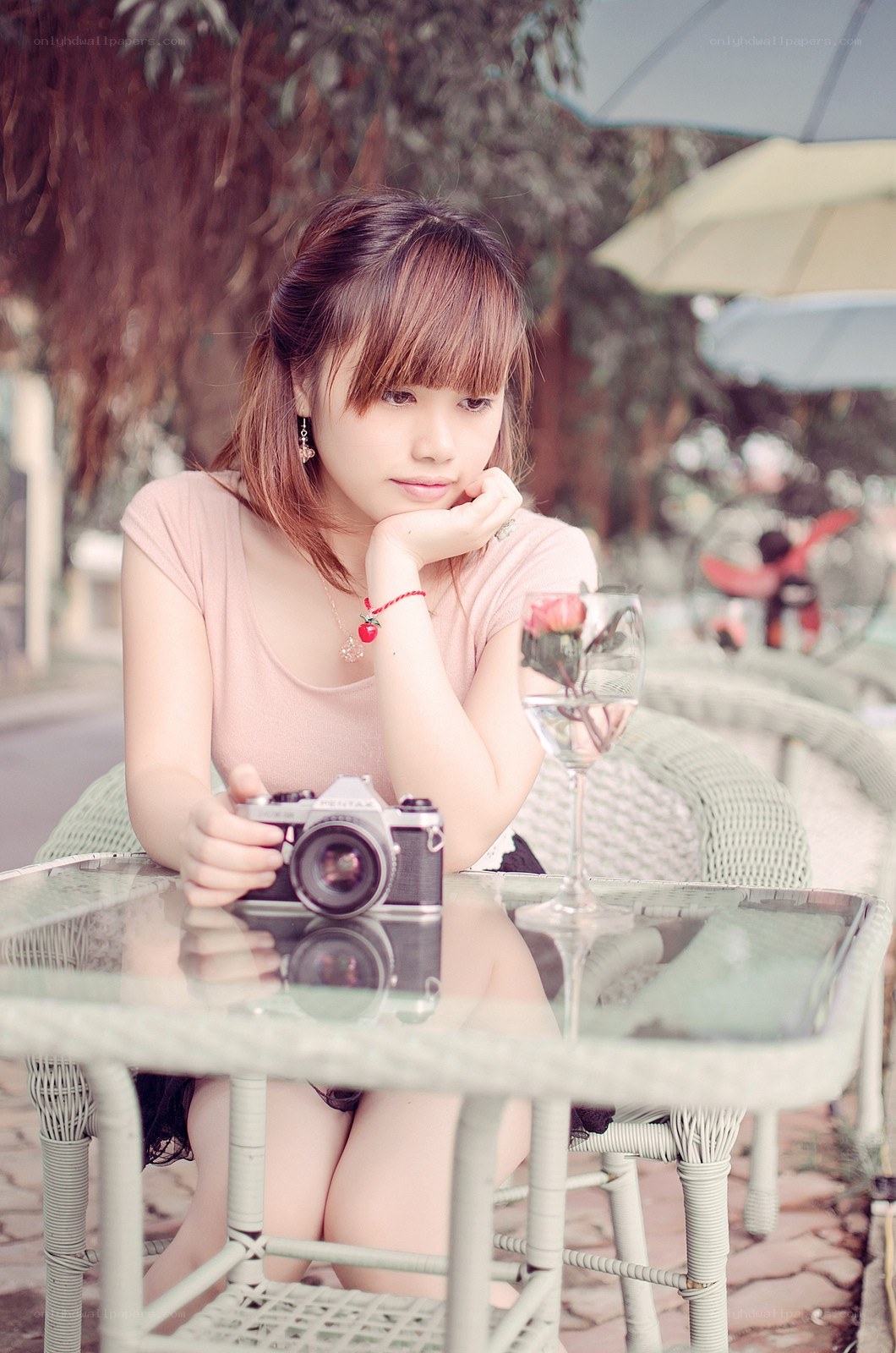 woman with camera at cafe