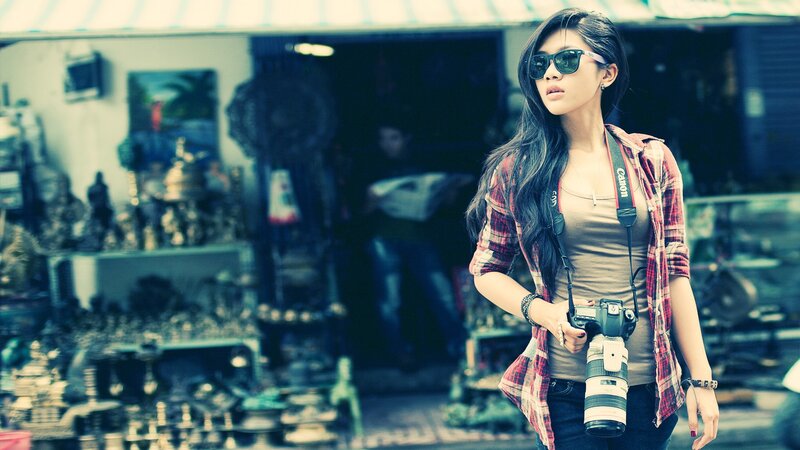 woman with camera at market