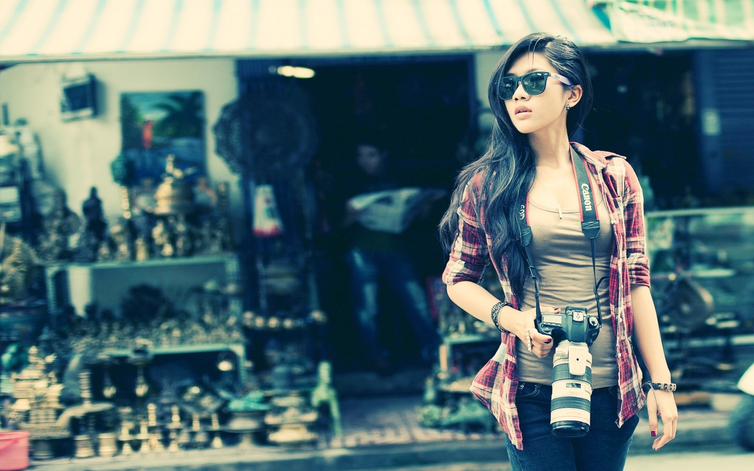 Woman with camera at market