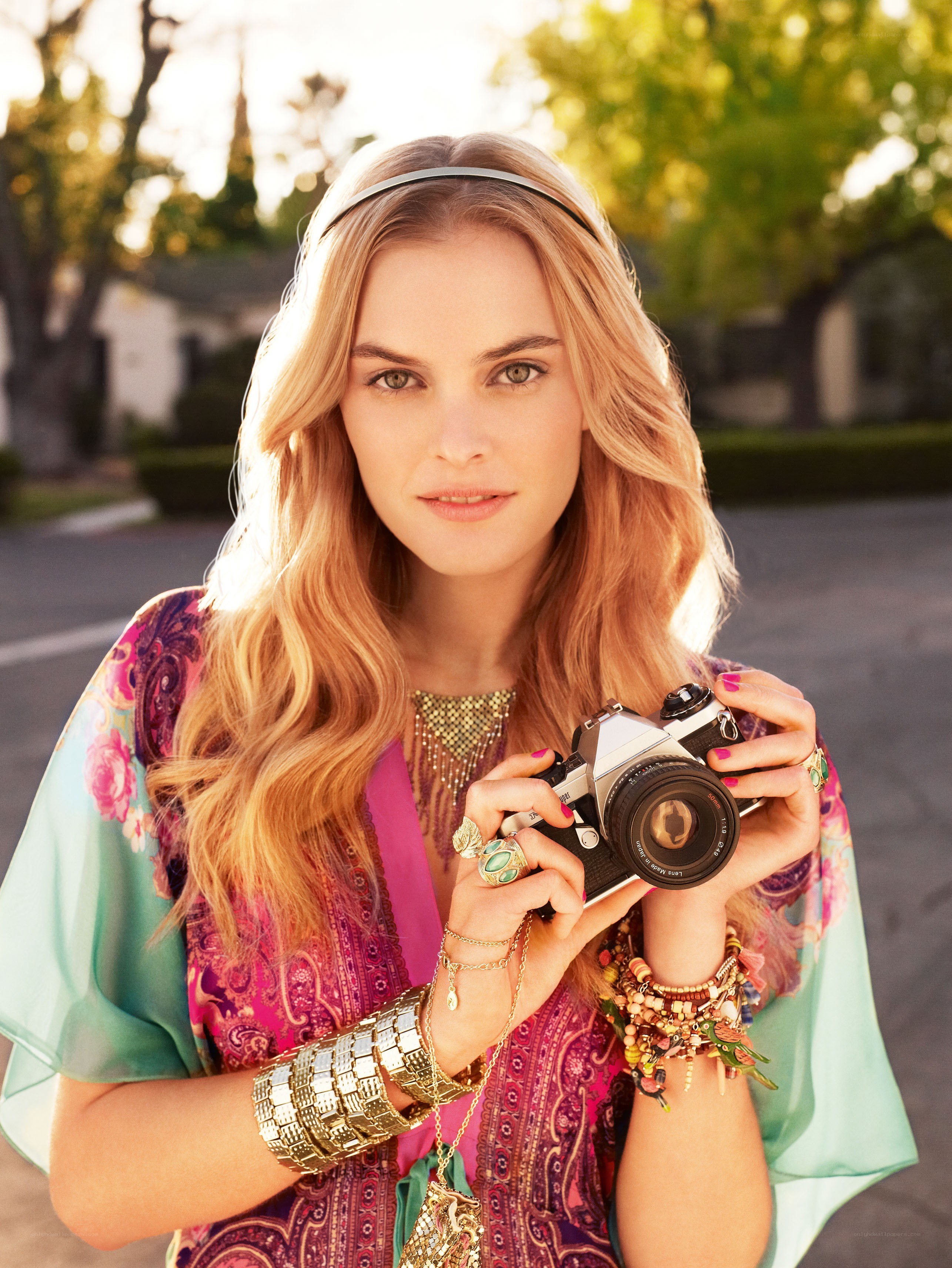 Woman with camera in boho style