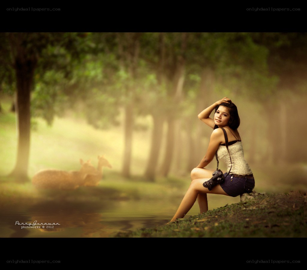 Woman with camera in forest