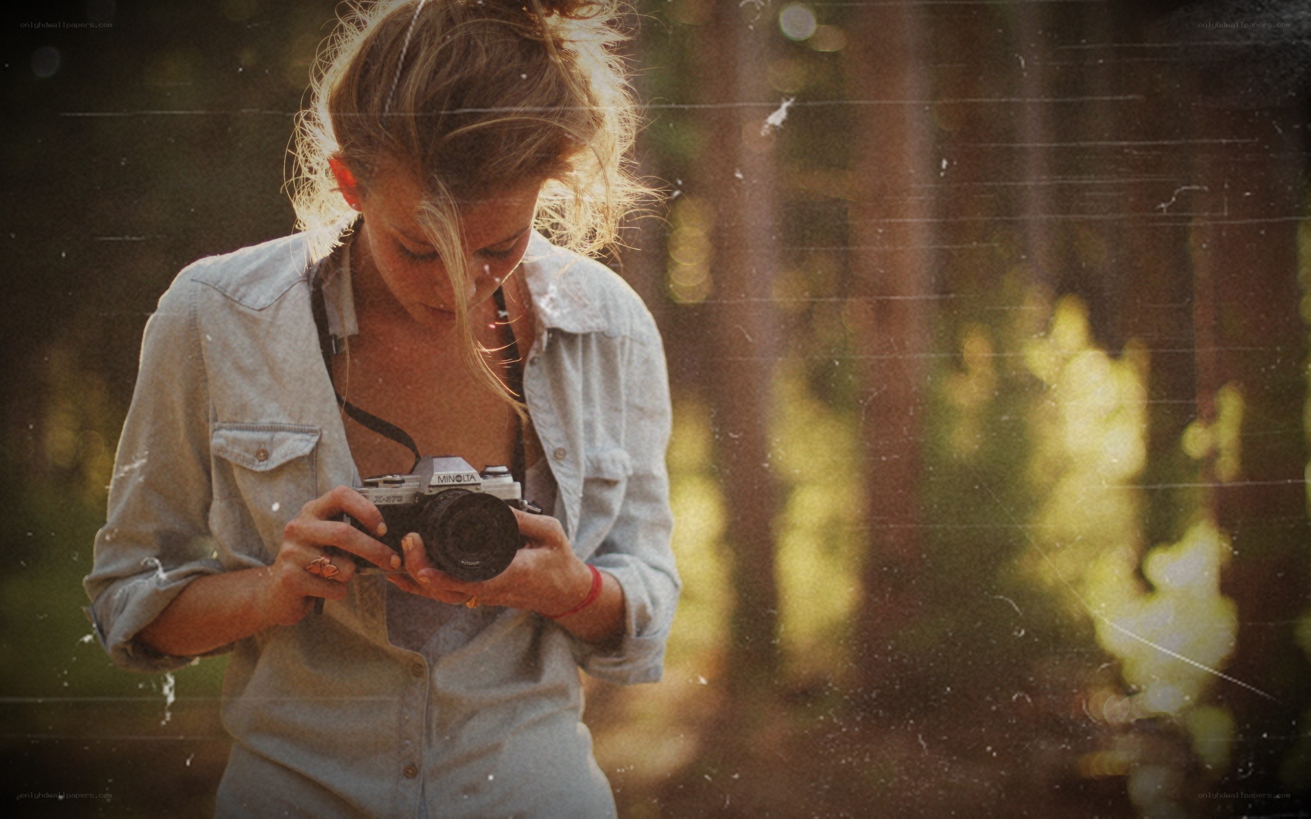 woman with camera in forest