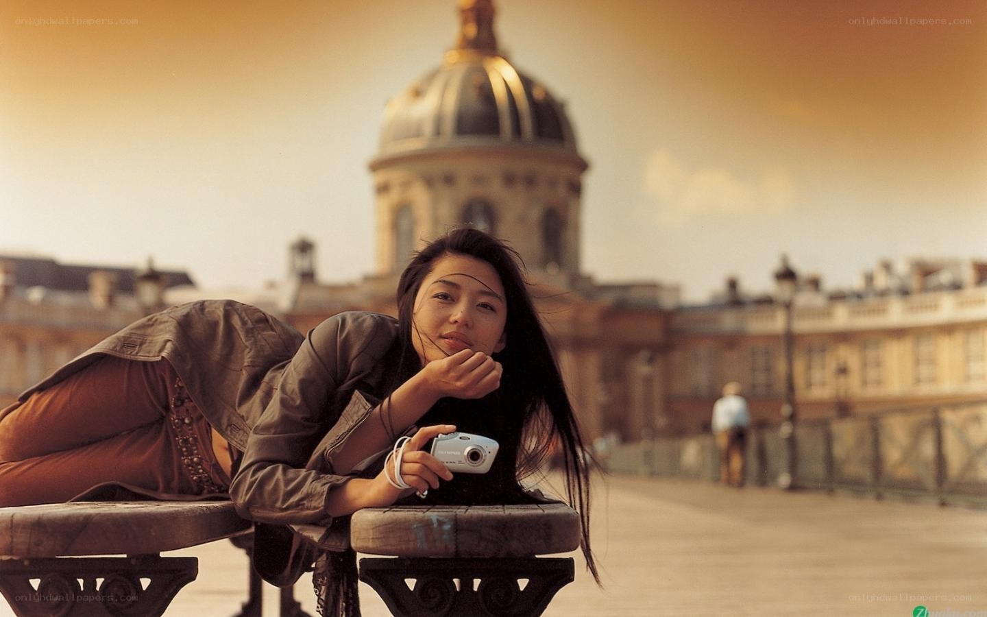 Woman with camera in Paris