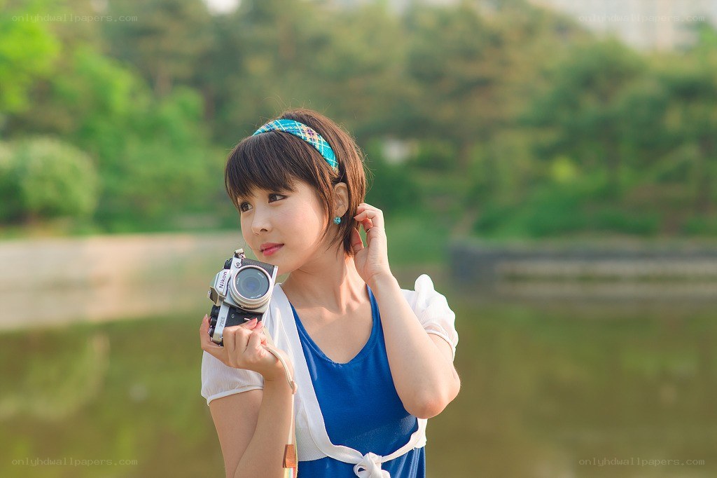 Woman with camera in park