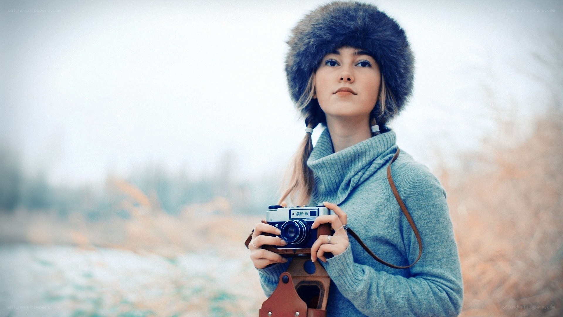woman with camera in winter