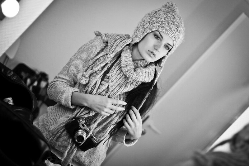 woman with camera in winter clothes