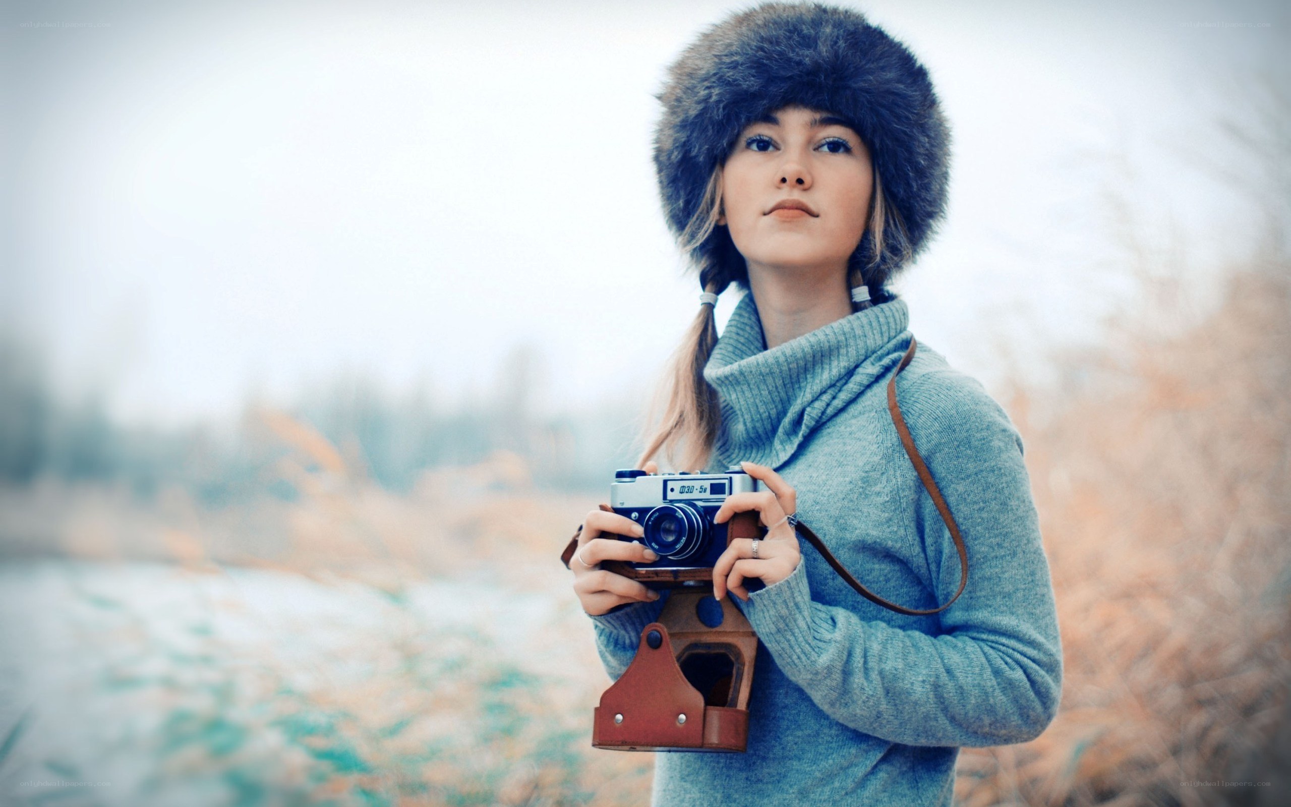 woman with camera in winter