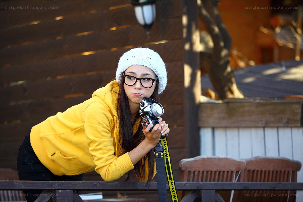 Woman with camera on deck