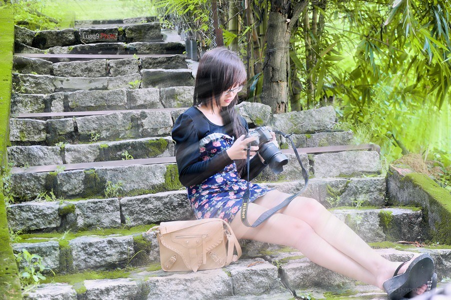Woman with camera on steps