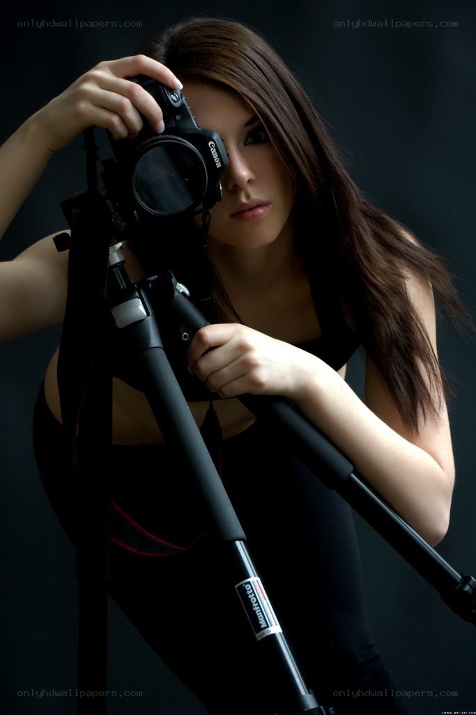 woman with camera on tripod