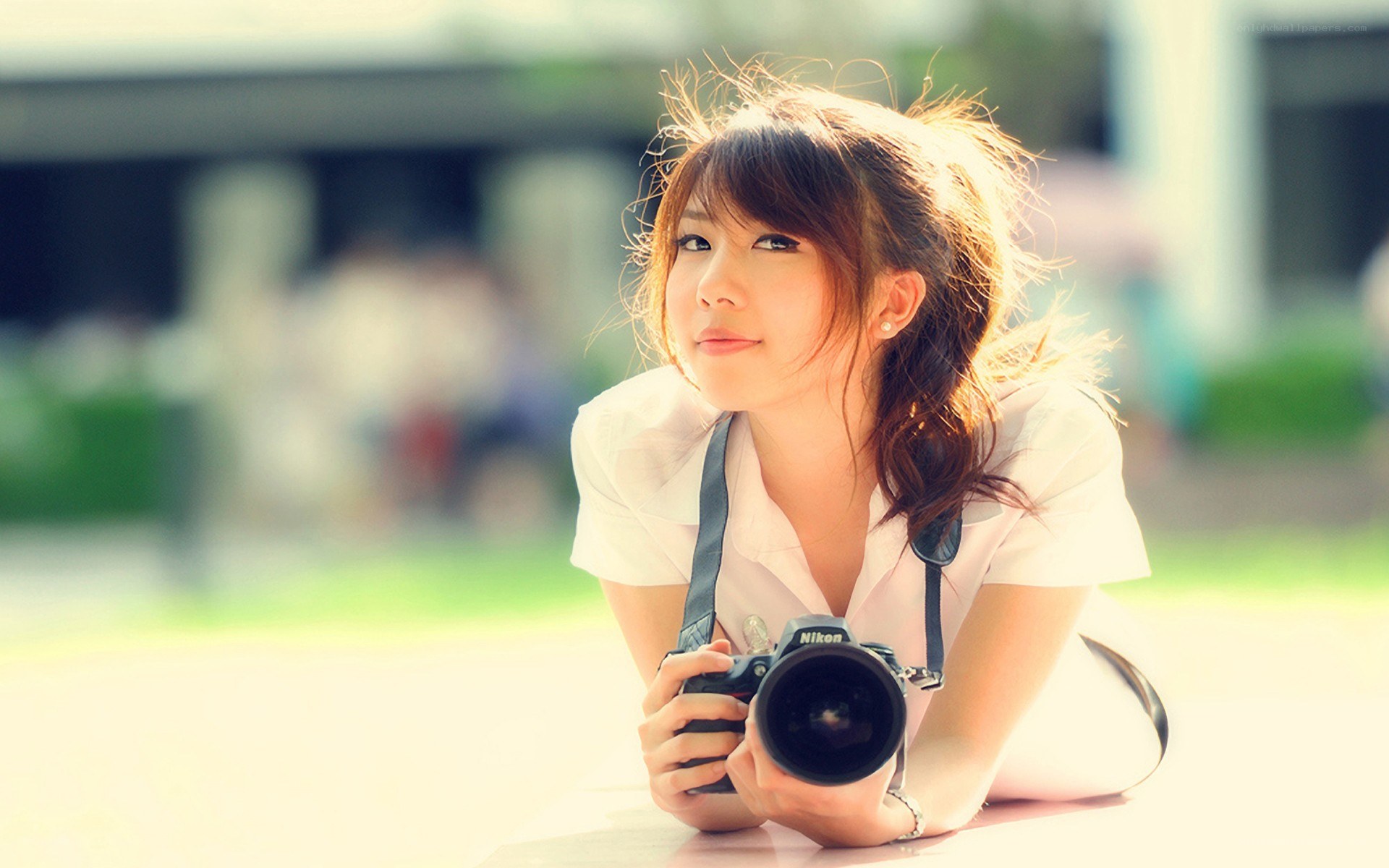 woman with camera outdoors