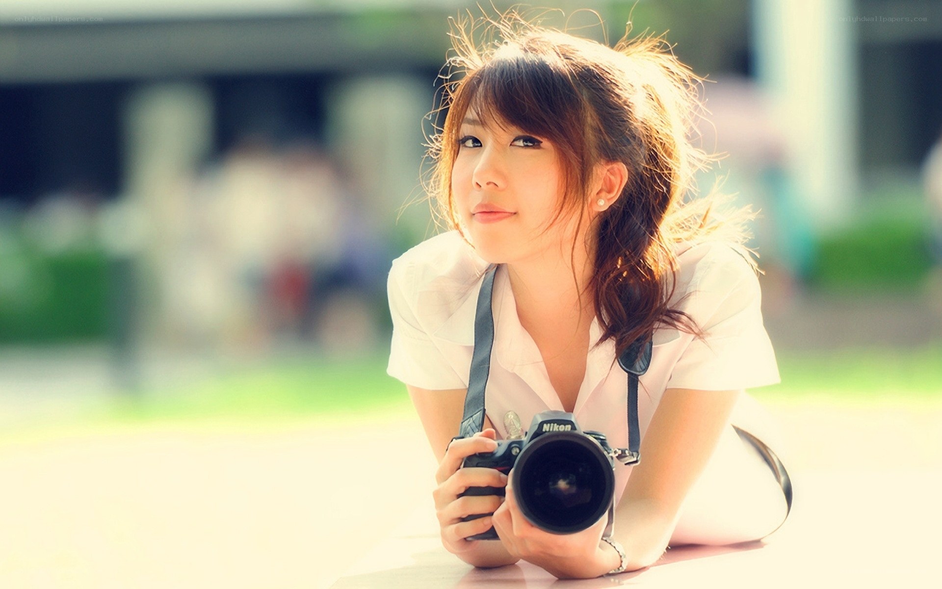 woman with camera outdoors