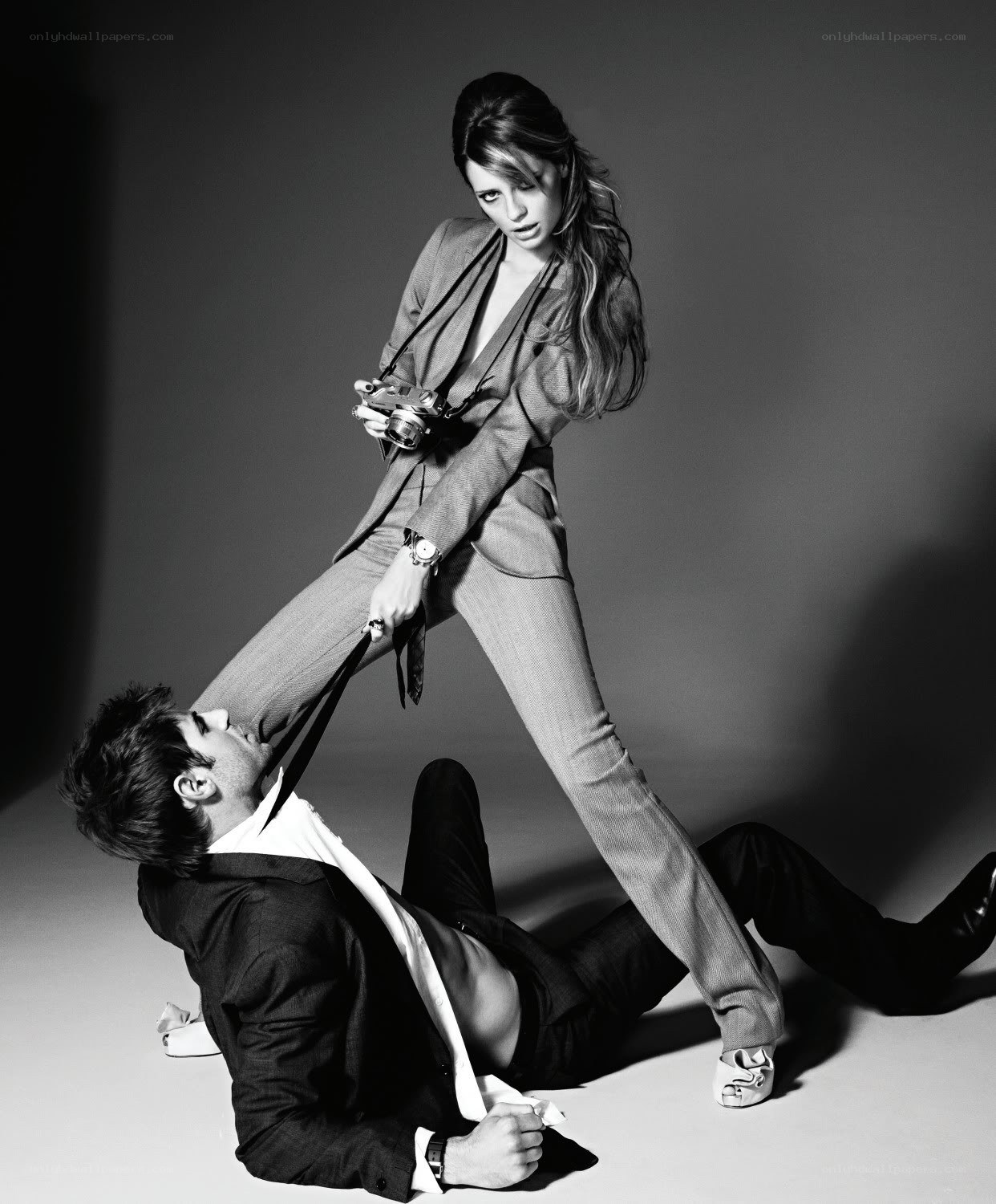 Woman with camera over man