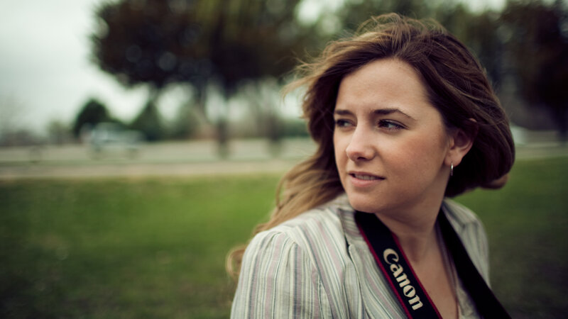 woman with camera strap